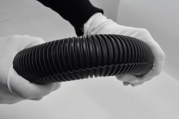 black corrugated conduit showing